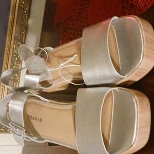 Urged Platform Heel Sandals Silver in color. New still have the tag.